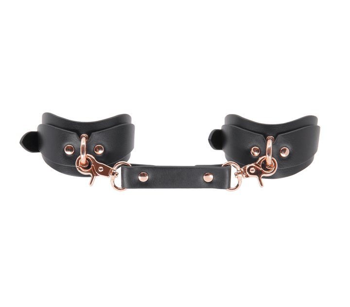 Shaped ankle cuffs with rose gold hardware - premium leather fetish restraints with contoured fit