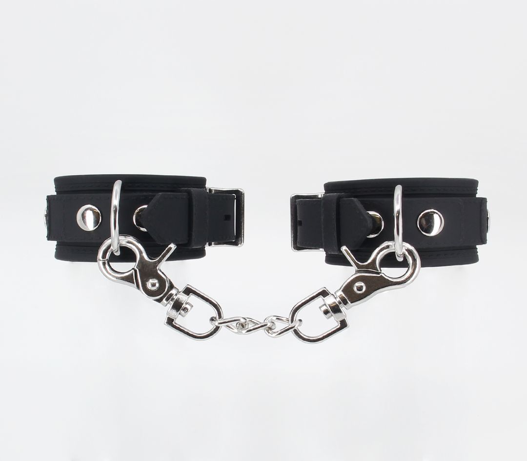 Heavy silicone cuffs close-up - showing thick silicone construction and secure buckle closure