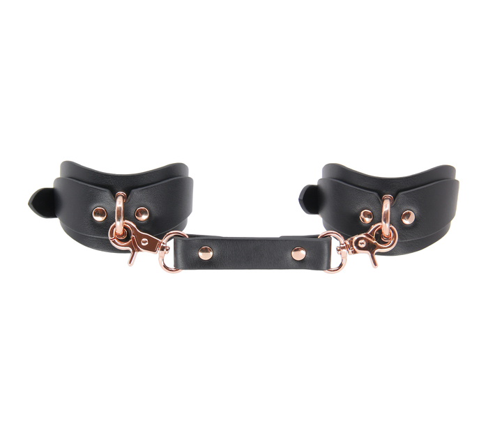 Shaped wrist cuffs with rose gold hardware - contoured leather restraints with premium finish