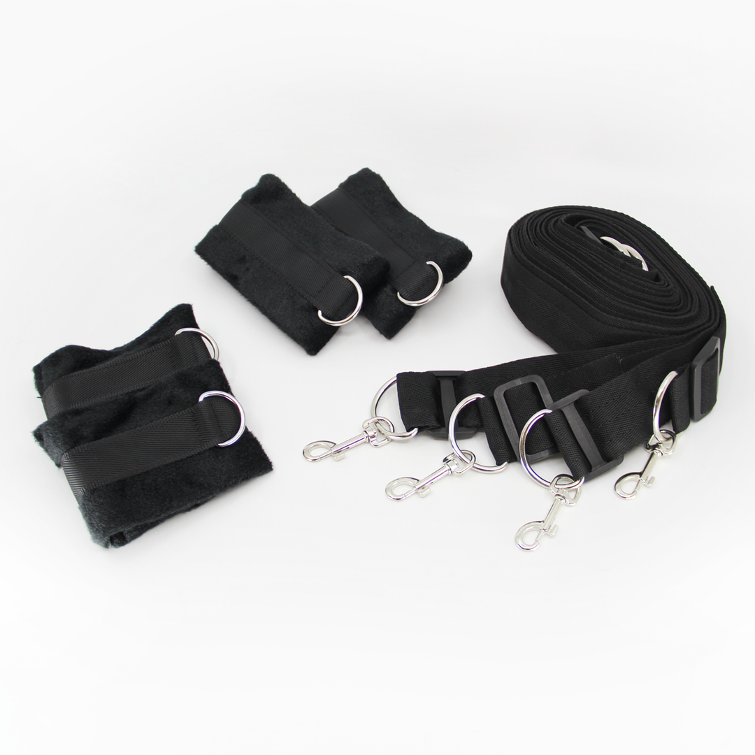 Under bed restraint system in use - showing adjustable cuffs and positioning straps