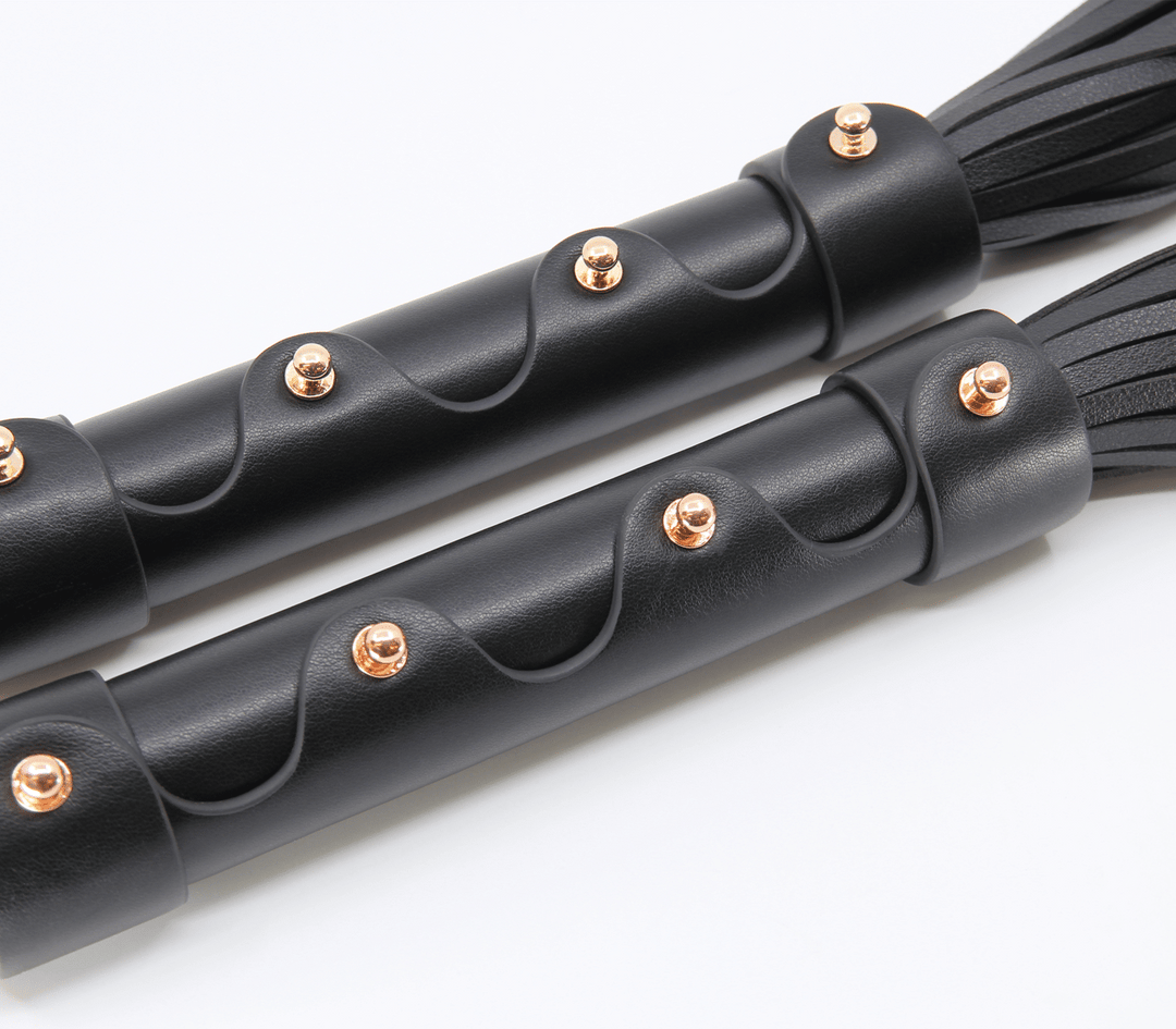 Love in Leather faux leather flogger - black impact toy with comfortable grip handle