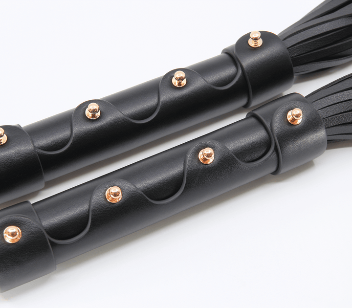 Love in Leather faux leather flogger - black impact toy with comfortable grip handle